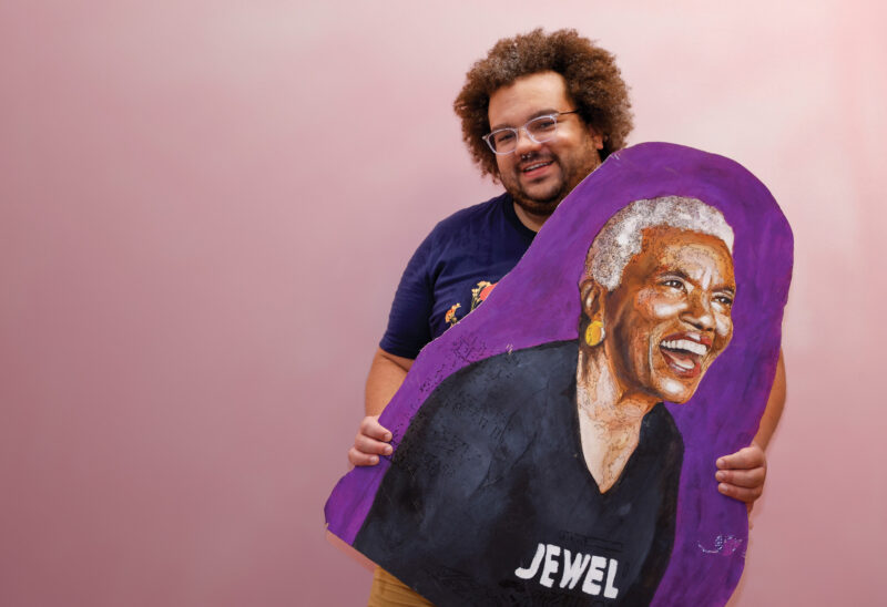 Randall Nielsen, founder of Queerlective, with a portrait of businesswoman and LGBTQ+ activist Jewel Thais-Williams, painted by Jackie Hanson. (Photo by Cheryl Senter)